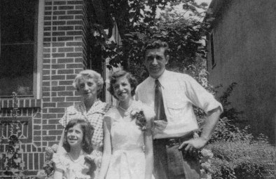 Merrill, age thirteen, with her sister Barbara, her mother and father, 1951